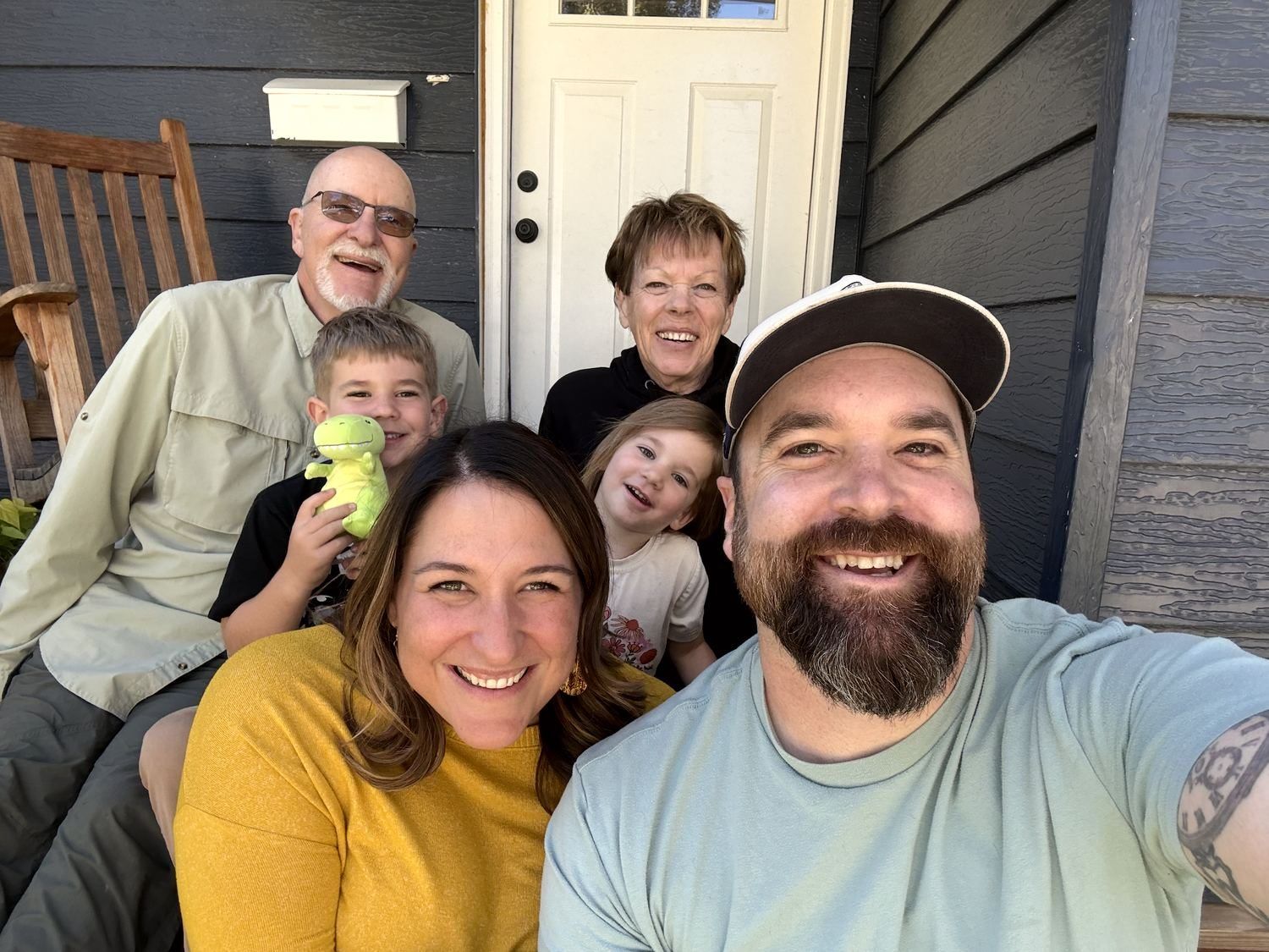 Three generations of a family together on a porch